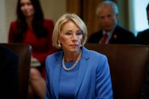 FILE - In this July 16, 2019, file photo, Education Secretary Betsy DeVos listens during a Cabi ...