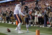 Chicago Bears quarterback Mitchell Trubisky, left, celebrates after connecting with wide receiv ...