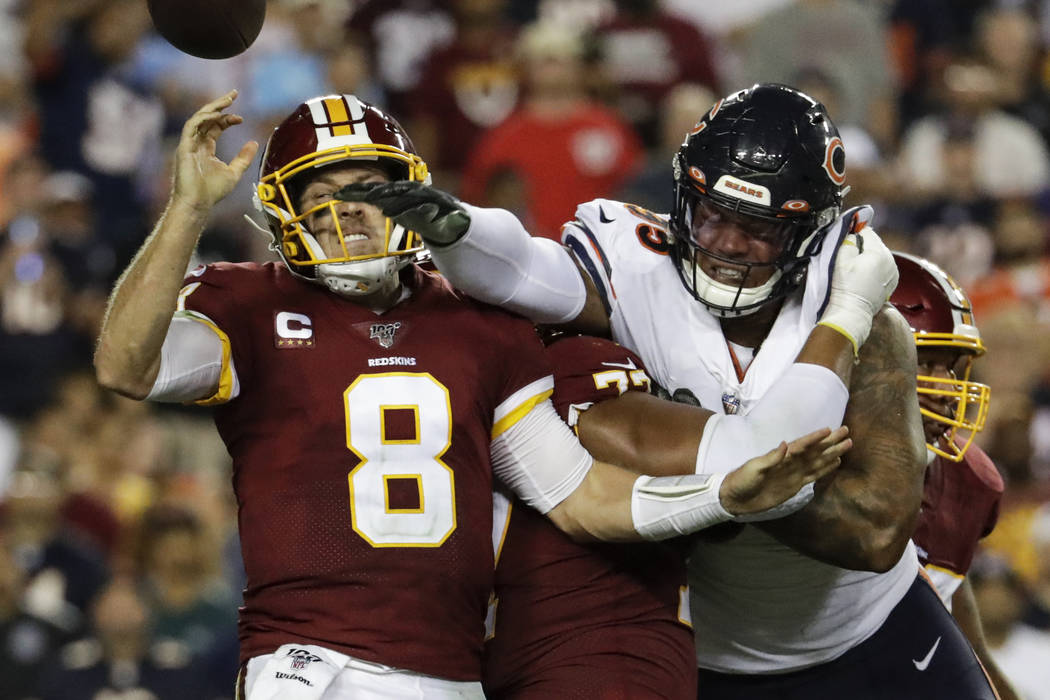 Chicago Bears outside linebacker Khalil Mack (52) hits Washington Redskins quarterback Case Kee ...