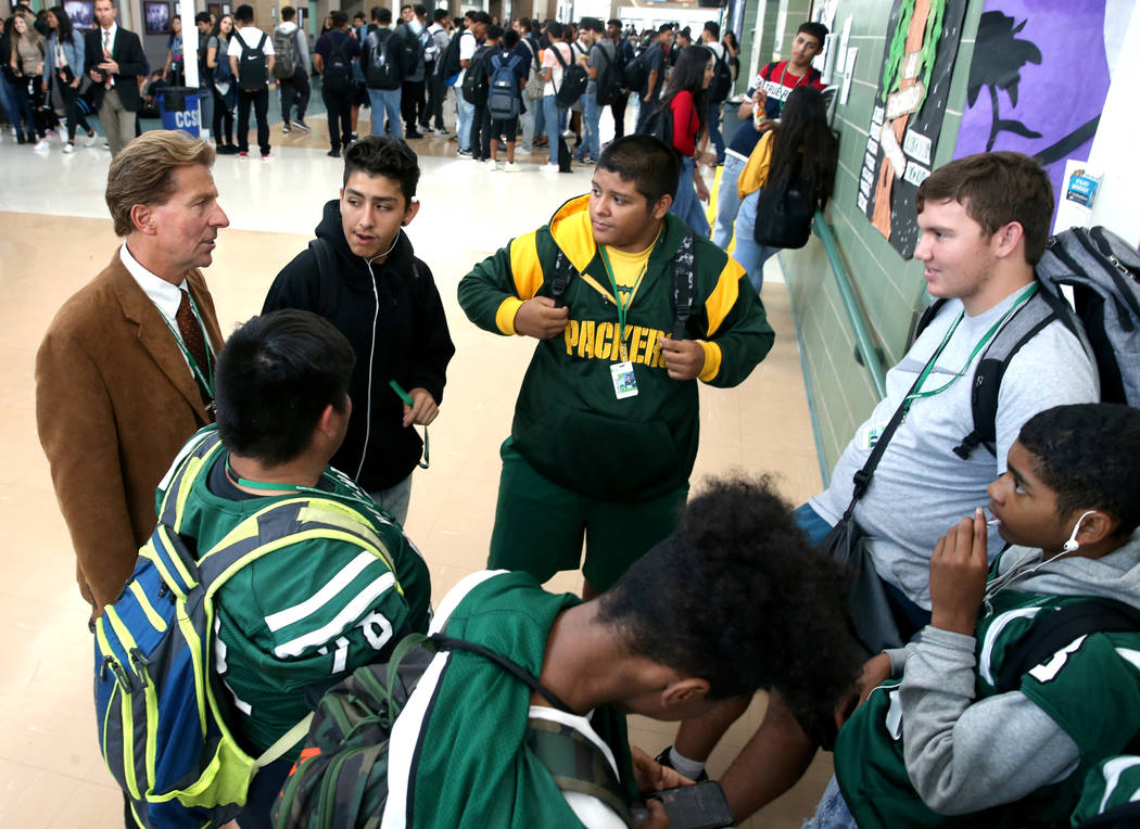 Principal James Kuzma visits with, clockwise from top left, Florentino Morado Guerrero, John Re ...