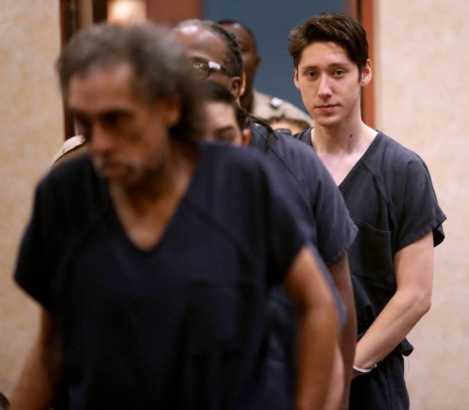 Giovanni Ruiz, 21, right, walks into the courtroom at North Las Vegas Justice Court, Tuesday, S ...