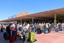British passengers with Thomas Cook wait in long queue at Antalya airport in Antalya, Turkey, M ...