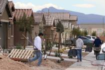 Construction workers at a new LGI Homes construction site at the Intersection of E. Lake Mead B ...