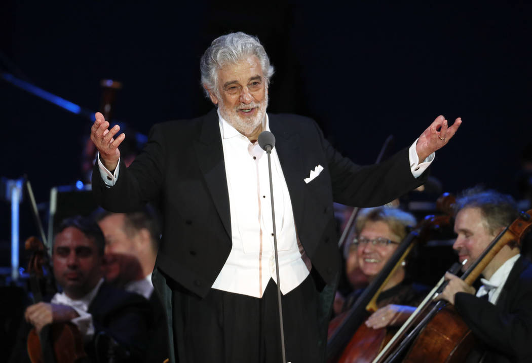 FILE - In this Aug. 28, 2019 file photo, opera star Placido Domingo salutes spectators at the e ...