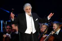 FILE - In this Aug. 28, 2019 file photo, opera star Placido Domingo salutes spectators at the e ...