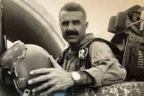 In a 1969 photo, a young Henry Buttelmann poses in his F-100 Super Sabre while serving in the V ...