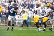Penn State running back Journey Brown (4) breaks away on a long run in the first quarter of an ...