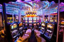 Hotel guests gamble on slot machines on a rotating surface at Circus Circus in Las Vegas on Sat ...