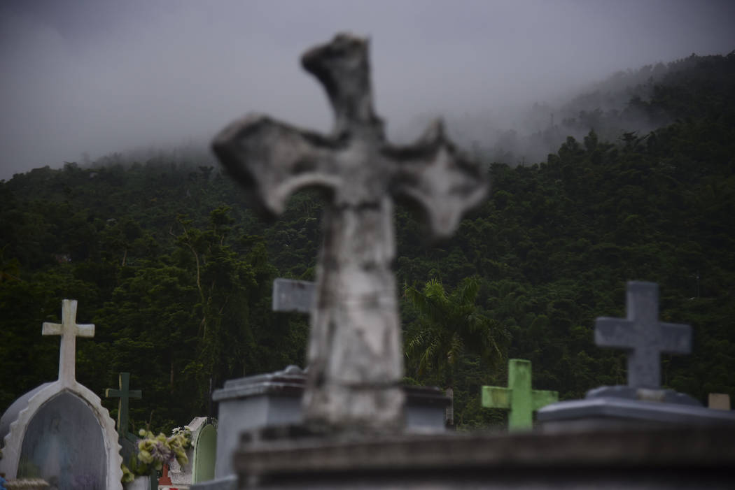 Clouds approach the Yabucoa municipal cemetery in Yabucoa, Puerto Rico, Tuesday, Sept. 24, 2019 ...