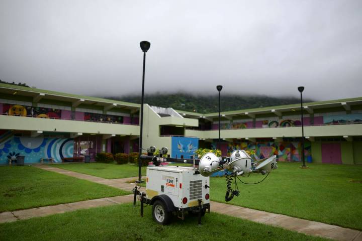 A portable light pole sits parked in a courtyard of Ramon Quinones Medina High School, where re ...
