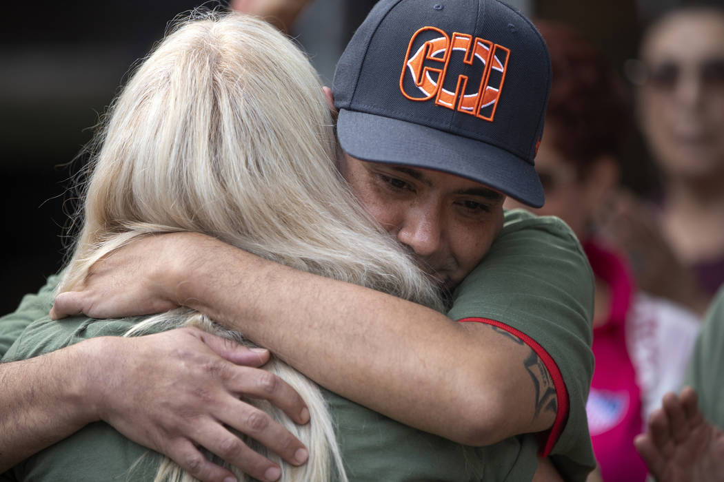 United States Army veteran Miguel Perez Jr. is greeted by friends and family at a news conferen ...