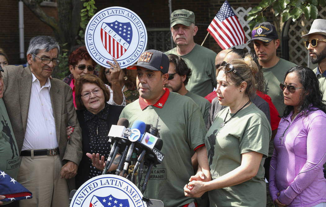 Miguel Perez Jr., center, is surrounded by family and supporters at a news conference in Chicag ...