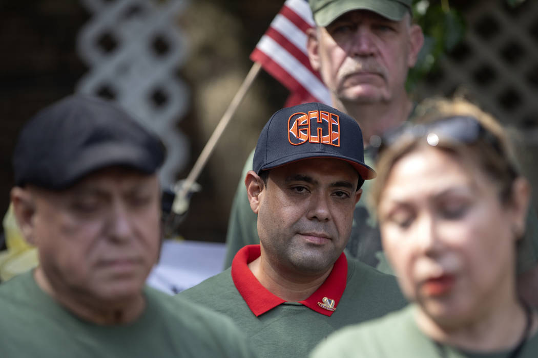 United States Army veteran Miguel Perez Jr. stands with his mother Esperanza Perez at a news co ...