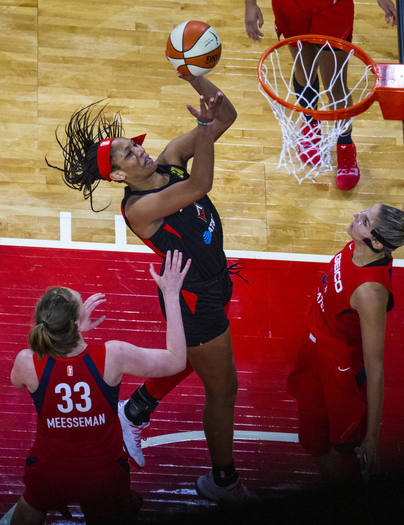 Las Vegas Aces center A'ja Wilson (22, right) looks to the basket over Washington Mystics cente ...