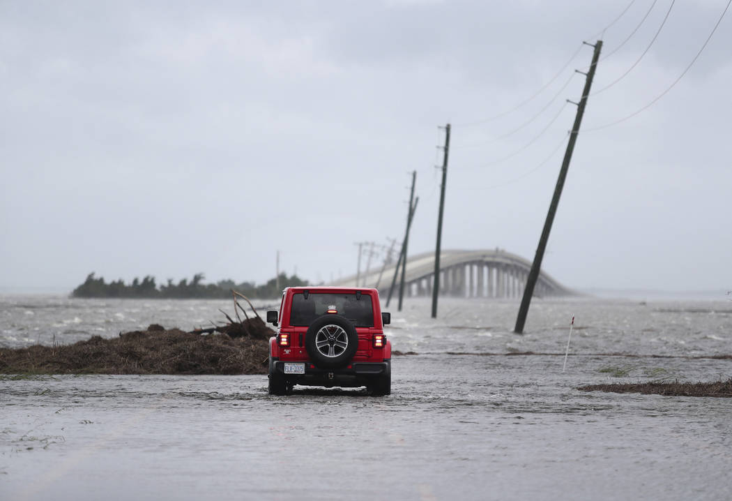 FILE - In this Friday, Sept. 6, 2019 file photo, storm surge from Hurricane Dorian blocks Cedar ...