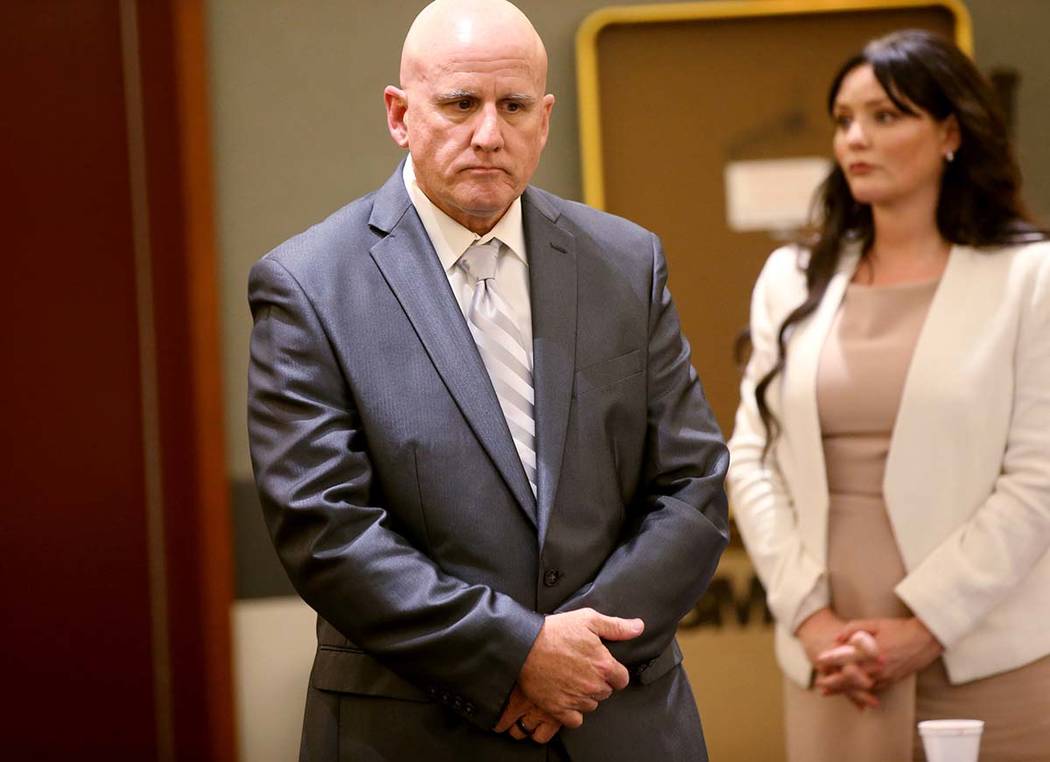 Las Vegas police Lt. James "Tom" Melton and one of his attorneys, Jean Schwartzer, st ...