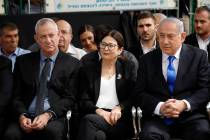 In a Thursday, Sept. 19, 2019, file photo, Blue and White party leader Benny Gantz, left, Esthe ...