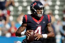 Houston Texans quarterback Deshaun Watson looks to pass against the Los Angeles Chargers during ...