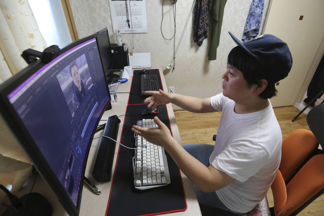 In this July 18, 2019, photo, North Korean refugee Jang Myung-jin edits his YouTube footage dur ...