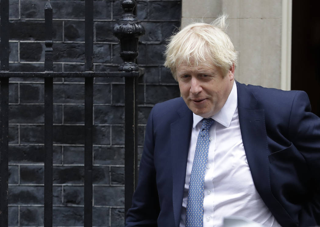 Britain's Prime Minister Boris Johnson leaves 10 Downing Street in London, Thursday, Sept. 26, ...