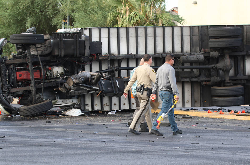 Las Vegas police investigate fatal crash involving two cars and a box truck at East Tropicana A ...
