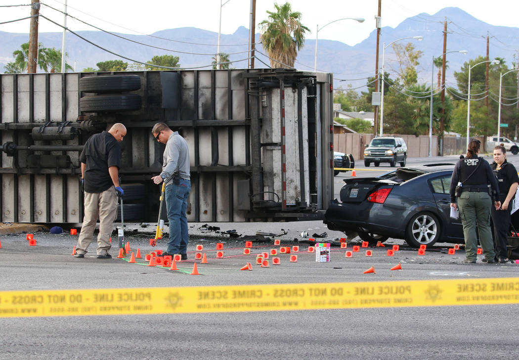 Las Vegas police investigate fatal crash involving two cars and a box truck at East Tropicana A ...