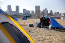 In a Tuesday, Jan. 27, 2015, file photo, Terry, cleans out his tent at a large homeless encampm ...