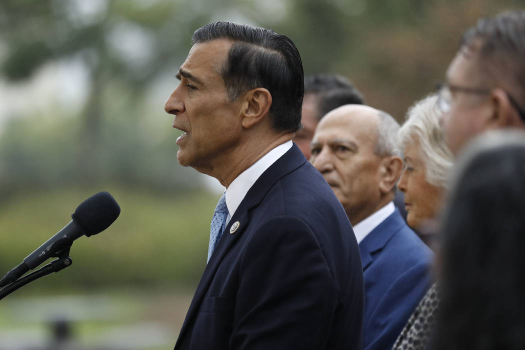 Darrell Issa, center, speaks during a news conference Thursday, Sept. 26, 2019, in El Cajon, Ca ...