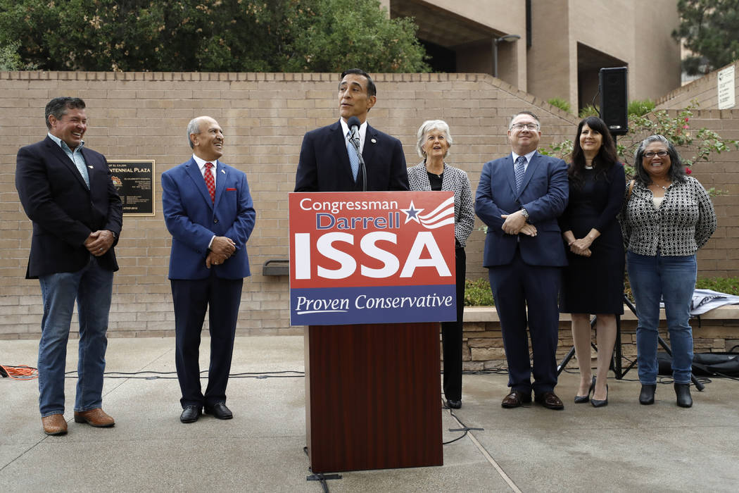 Darrell Issa, center, speaks during a news conference Thursday, Sept. 26, 2019, in El Cajon, Ca ...