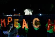 Protesters with "Kremlin Annex" call to impeach President Donald Trump in Lafayette S ...