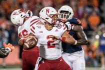Nebraska quarterback Adrian Martinez (2) passes in the first half of an NCAA college football g ...