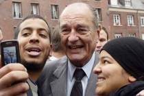 FILE - In this Nov.14, 2006 file photo, French President Jacques Chirac poses with residents du ...