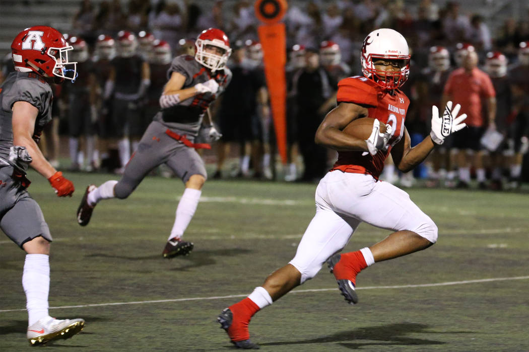 Arbor View's Daniel Mitchell (24) looks back at American Fork's Brendon Bourgeois (83) as he sp ...