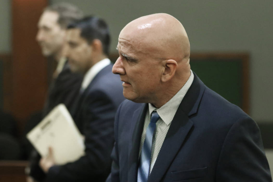 Las Vegas police Lt. James "Tom" Melton, right, reacts after being found not guilty o ...
