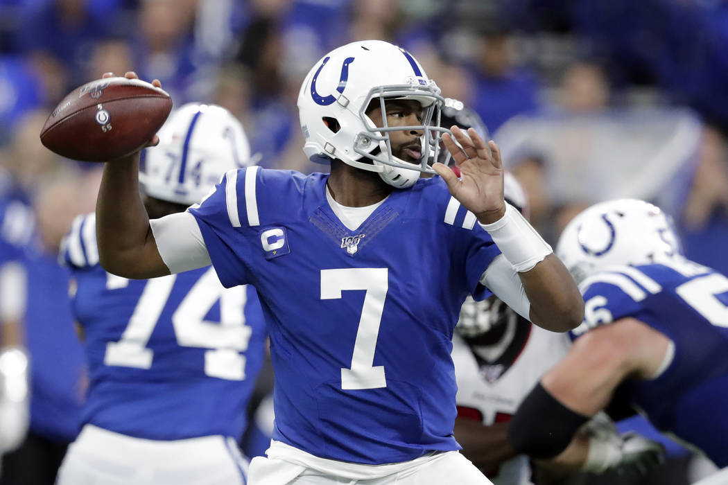 Indianapolis Colts quarterback Jacoby Brissett (7) throws during the first half of an NFL footb ...