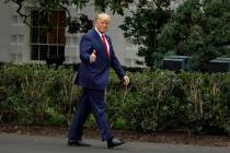 President Donald Trump gives the thumbs-up as he arrives for a ceremony on the South Lawn of th ...