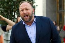 FILE- In this Sept. 5, 2018, file photo conspiracy theorist Alex Jones speaks outside of the Di ...