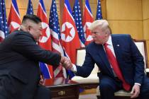 FILE - In this June 30, 2019, file photo, U.S. President Donald Trump, right, meets with North ...