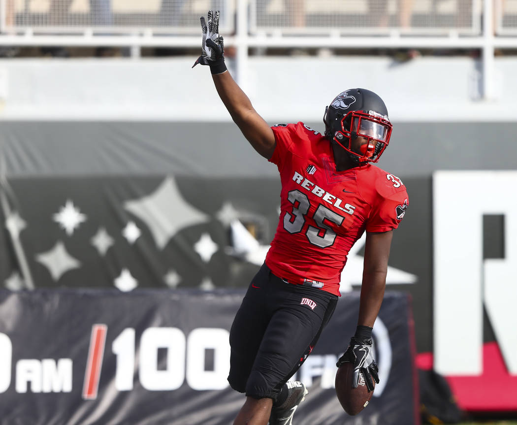 UNLV running back Xzaviar Campbell (35) celebrates his touchdown during a football game against ...