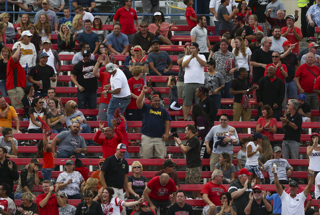 UNLV fans cheer after a touchdown by UNLV quarterback Kurt Palandech (14) during a football gam ...