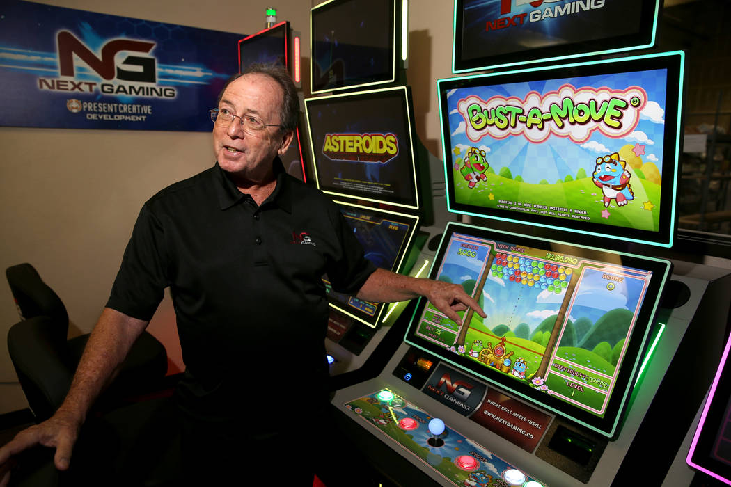 Next Gaming CEO Mike Darley shows some of his soon-to-be-released arcade game-based slot machin ...
