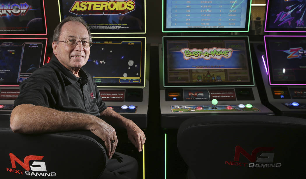 Next Gaming CEO Mike Darley with some of his soon-to-be-released arcade game-based slot machine ...