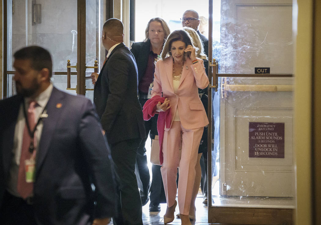 Speaker of the House Nancy Pelosi, D-Calif., arrives at the Capitol in Washington, as she manag ...