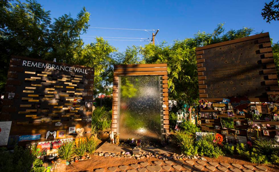 The Remembrance Wall is seen next to a water feature, center, and a quote wall, right, at the L ...