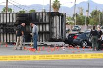 Las Vegas police investigate a fatal crash involving two cars and a box truck at East Tropicana ...