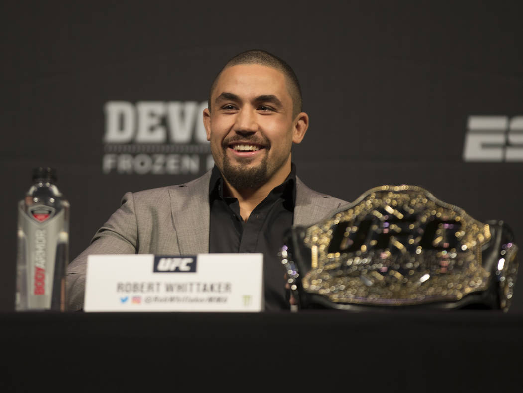 UFC middleweight champion Robert Whittaker addresses the media during a press conference on Fri ...