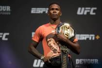 UFC interim middleweight champion Israel Adesanya holds his belt during a press conference on J ...