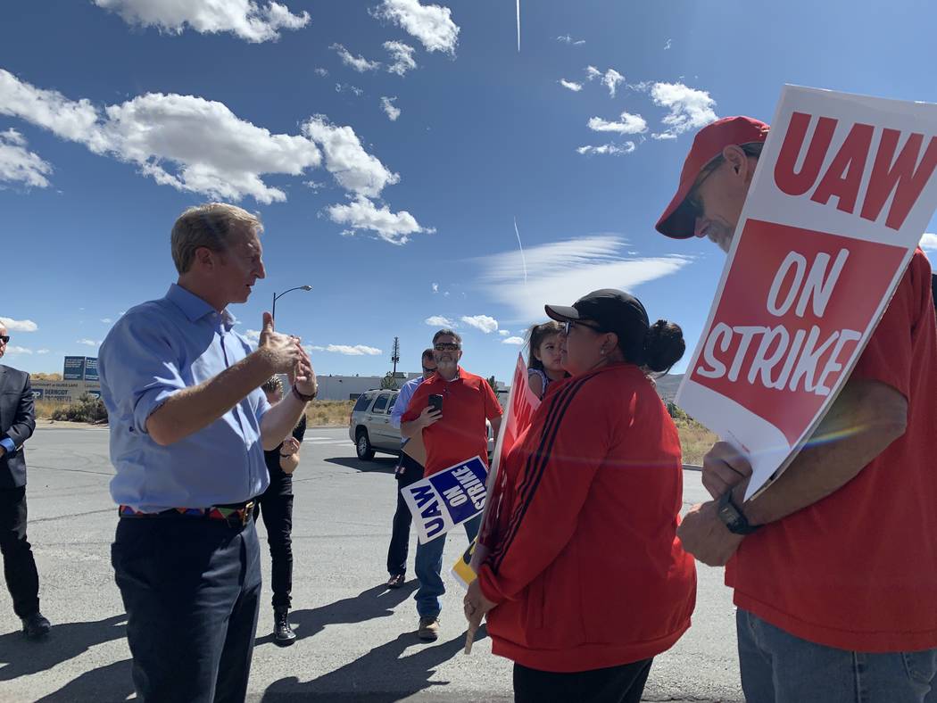 Democratic presidential candidate Tom Steyer speaks to striking auto workers outside a GM parts ...