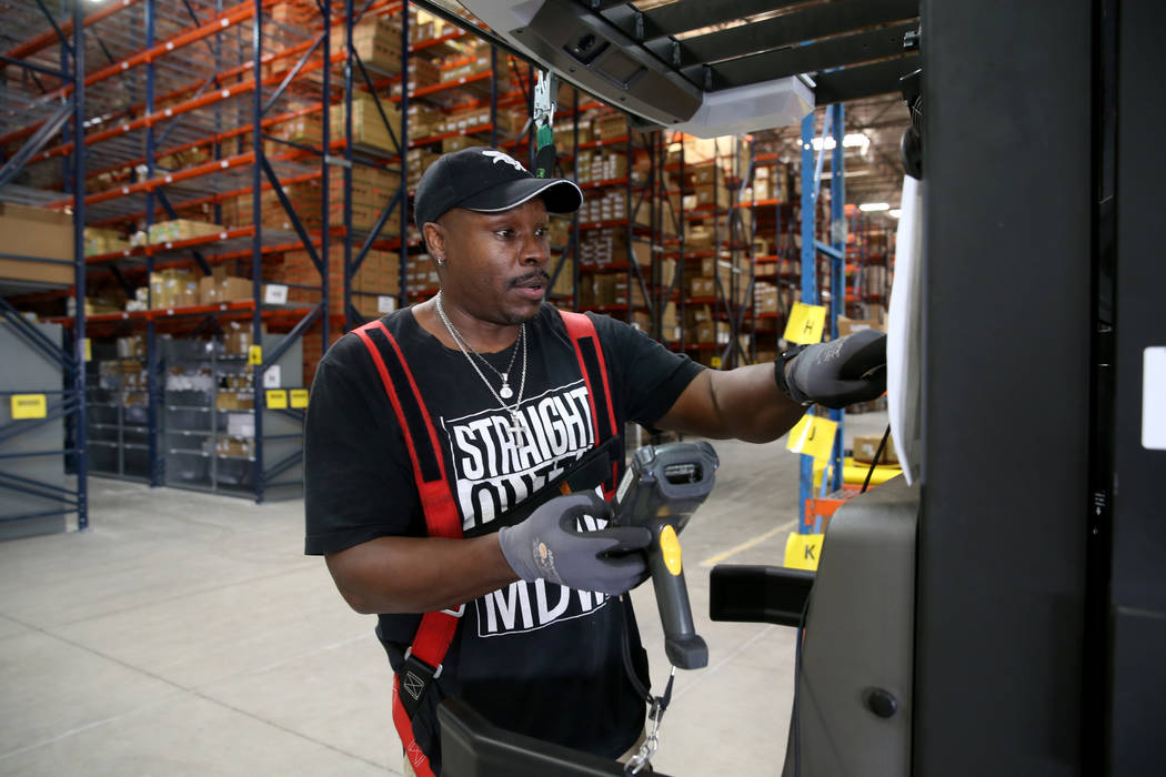 Cherry Picker Donald Marshall fills an order at the new CarParts.com distribution facility in L ...