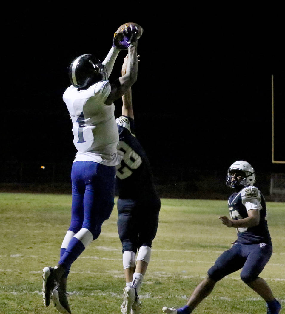 Desert Pines High's wide receiver Darnell Washington (1) jumps over Foothill High's corner ...
